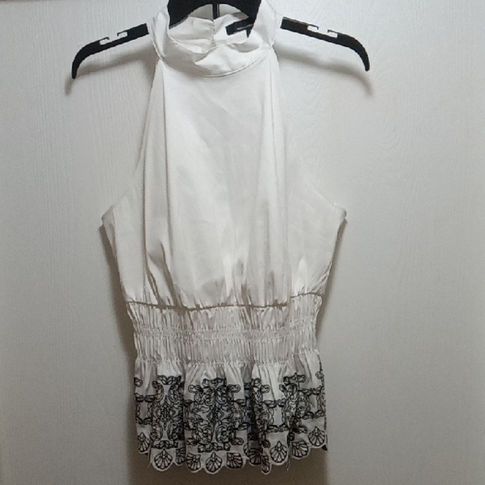 Elegant White Sleeveless Top with Black Embroidery